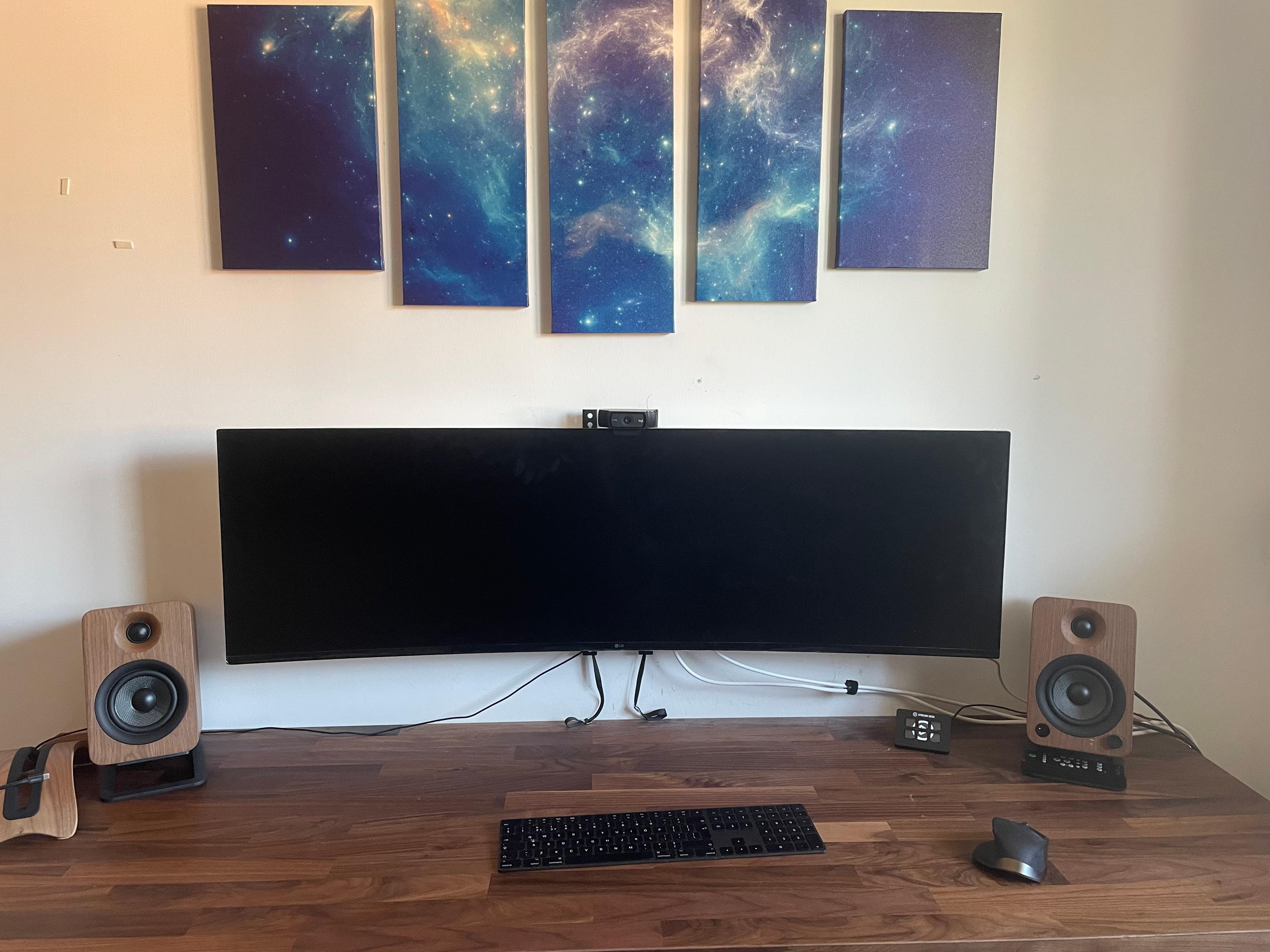 Monitor, speakers and laptop stand view